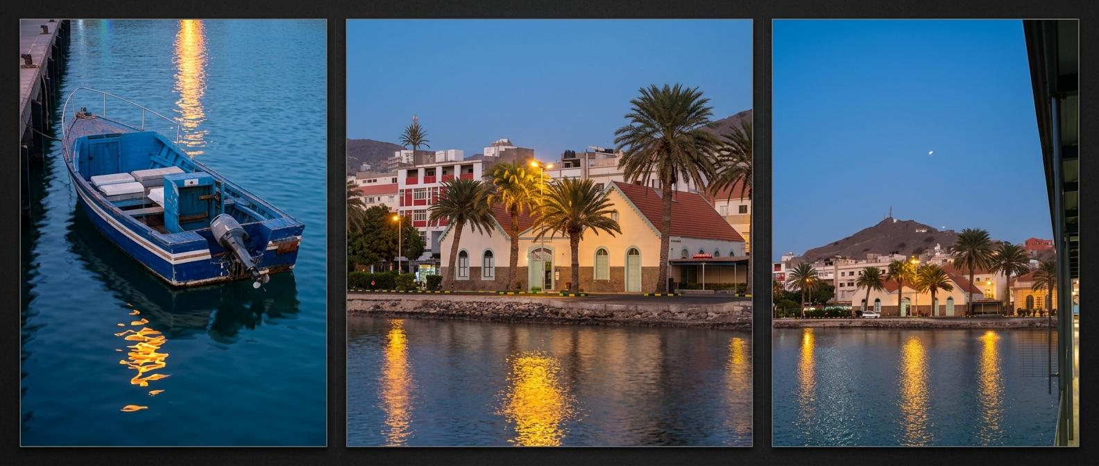 MIndelo, Sao Vicente island - Blue boat on calm water, and waterfront buildings with palm trees glowing at dusk.